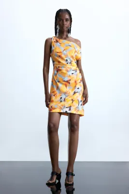 ​Short dress with an asymmetrical neckline