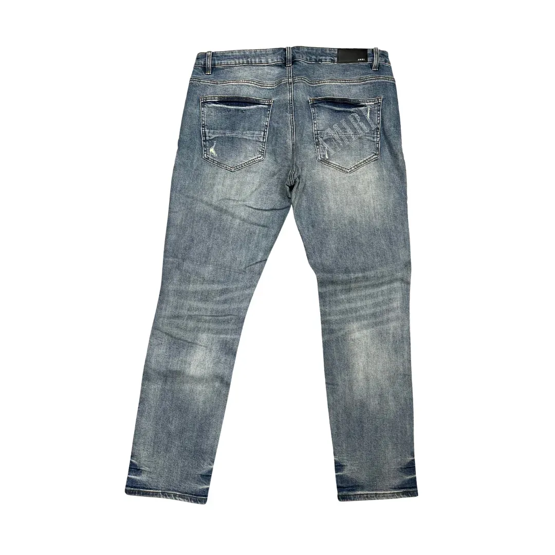 Amiri MX1 Ripped Patch Slim Jeans