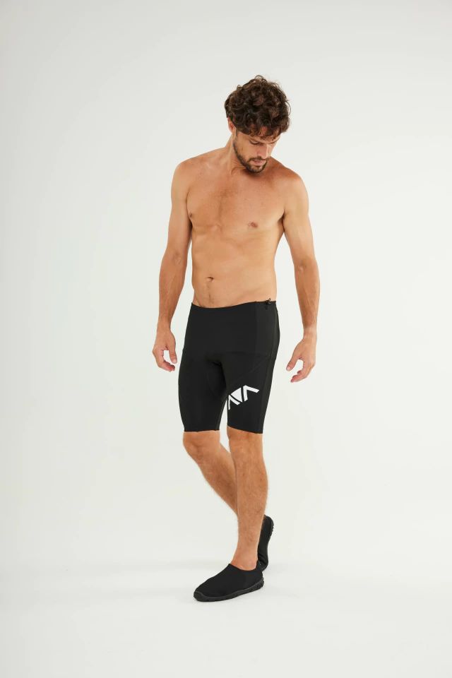 Man wearing Johnn Brava neoprene 1.5mm wetsuit bermuda shorts