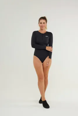 Woman wearing Johnn Brava black long sleeve UPF 50+ bodysuit at the beach