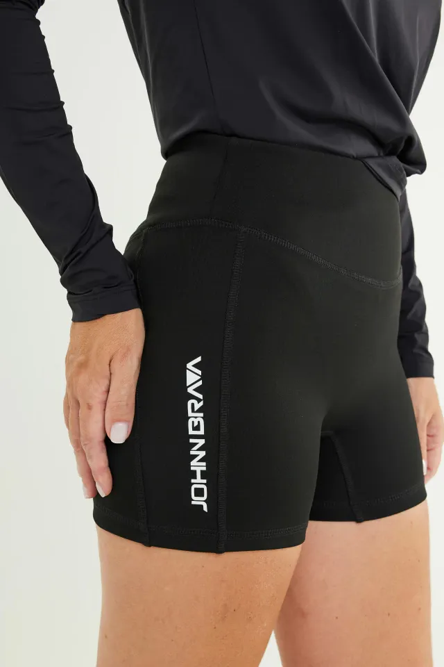 Woman wearing Johnn Brava neoprene 1.5mm wetsuit bermuda shorts - view 2