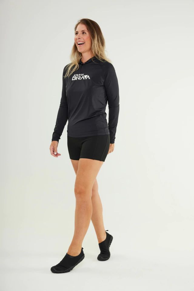 Woman wearing Johnn Brava neoprene 1.5mm wetsuit bermuda shorts