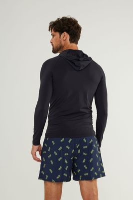 Man wearing Johnn Brava black hooded lycra top with UV protection while surfing - view 2