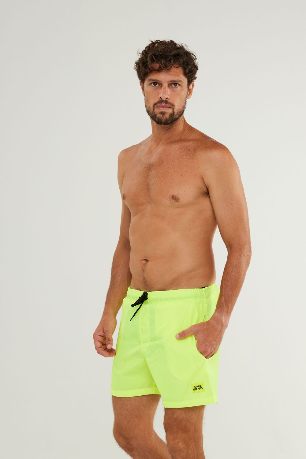 Man wearing Johnn Brava lemon yellow activewear shorts