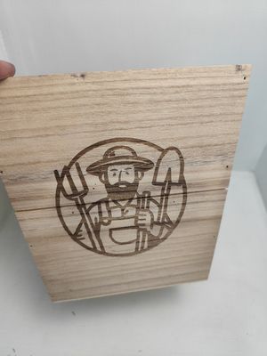 Engraved plant pot featuring the Gardener’s Touch design with pitchfork, shovel, and custom text area