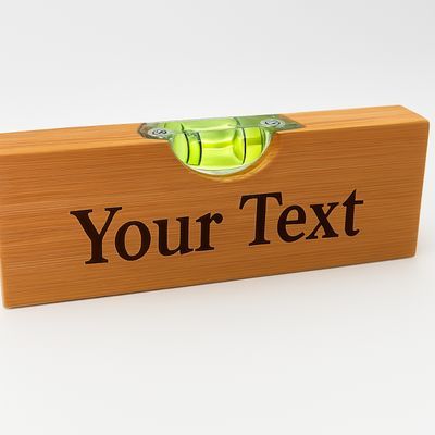 Engraved bamboo bottle opener with built‑in spirit level and personalised custom text