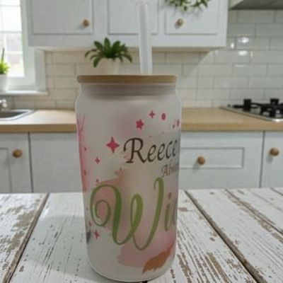Eco-friendly frosted glass tumbler with bamboo lid and straw, personalised with any name, message, and custom avatar design.