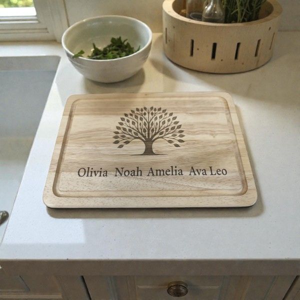 Engraved wooden chopping board featuring a detailed family tree design with personalised names and custom text.