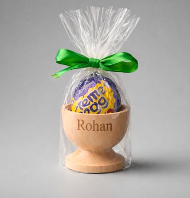 🐣 Personalised Engraved Wooden Easter Egg Cup — Any Name Engraved wooden Easter egg cup with custom name, gift‑wrapped with a Cadbury Creme Egg and green satin ribbon