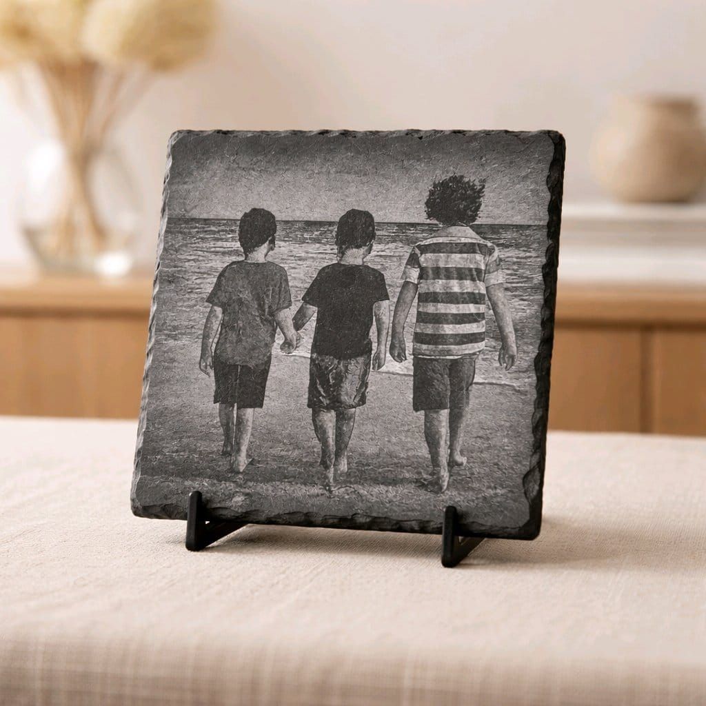 Custom engraved slate coaster with chosen font style, displaying clear text on rustic natural slate.