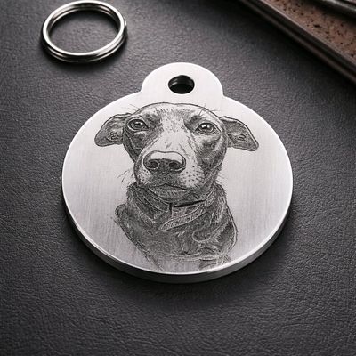 Personalised aluminium dog tag engraved with your dog’s photo and contact details, creating a durable ID tag for everyday pet