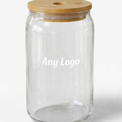 Clear glass tumbler with bamboo lid and reusable straw, printed with “Any Logo” text, minimalist eco‑friendly design