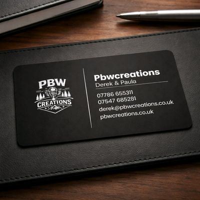 Premium black 0.8mm stainless steel business card with deep laser‑engraved logo and text, matte finish, custom metal business