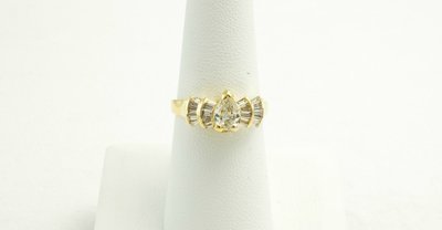 18 Karat Yellow Gold Engagement Ring With Diamonds.