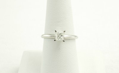 14 Karat White Gold Solitaire Princess Cut Engagement Ring.