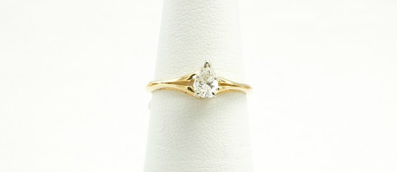 14 Karat Yellow Gold Solitaire Pear Shape Diamond Ring.