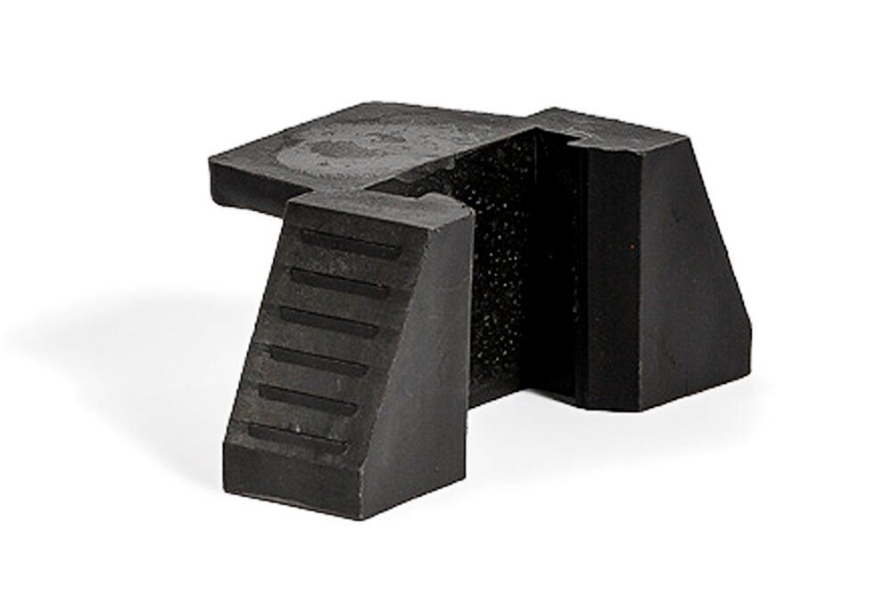 Black plastic brake lock with ribbed surface on one side