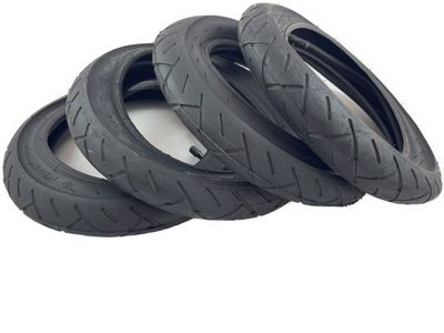 Four black tires and tubes for Dino-Cars Speedy, with tread pattern