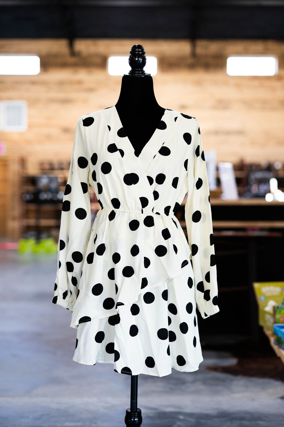 cream and black polta bot dress