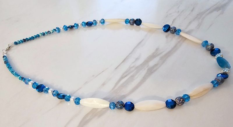 Bright blue crystals, blue hematite&#39;s, and blue lava stones with white shells