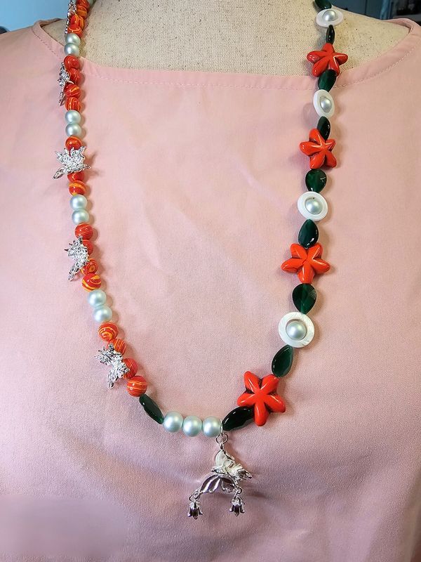 Two tone orange flowers with butterflies, pearls and green cat eyes