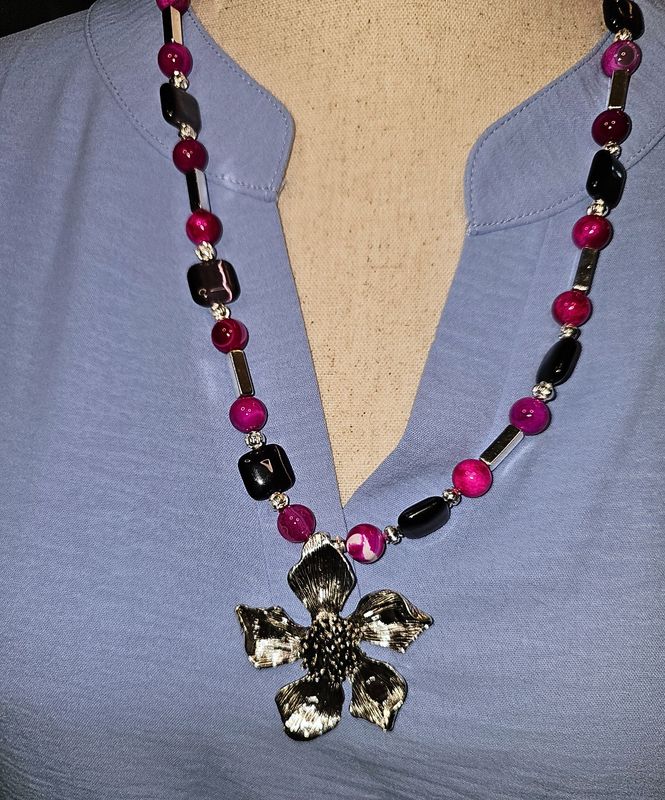Purple cat eye with silver flower