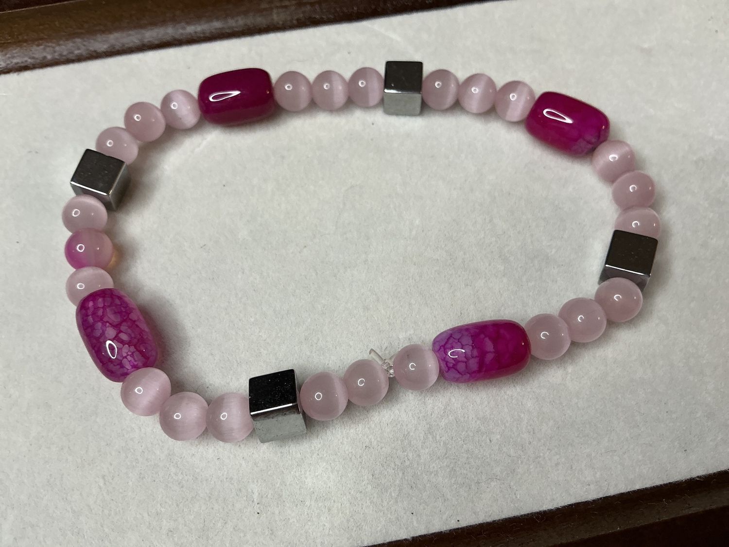 Cat Eye pink barrel with silver spacers