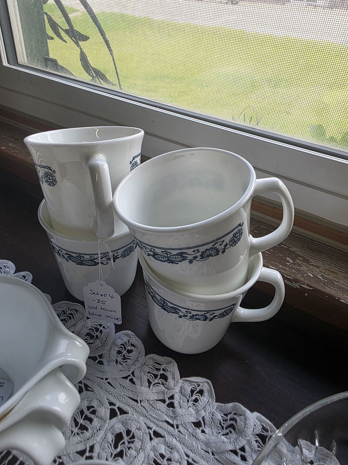 4 blue and white corning mugs