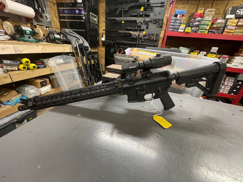 Anderson AR 15, 223 Wylde caliber, 16 inch 1:9 stainless dimpled barrel with brake. 45’degree offset sights, Riton red dot with 3X flip to side magnifier. Adjustable stock 1 P mag
