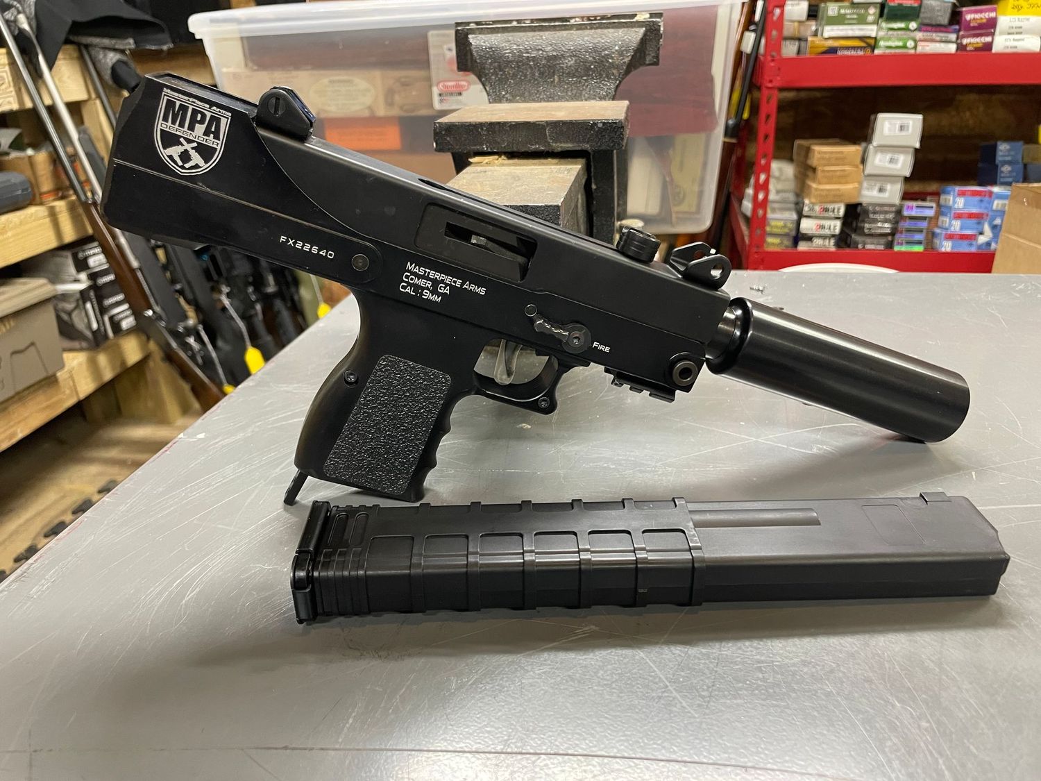 Masterpiece Arms, Mac 9 type, Top cocker, 9mm, 1, 30 round mag. Fake suppressor. Excellent/Unfired, original hard case Masterpiece Arms, Mac 9 type, Top cocker, 9mm, 1, 30 round mag. Fake suppressor. Excellent/Unfired, original hard case