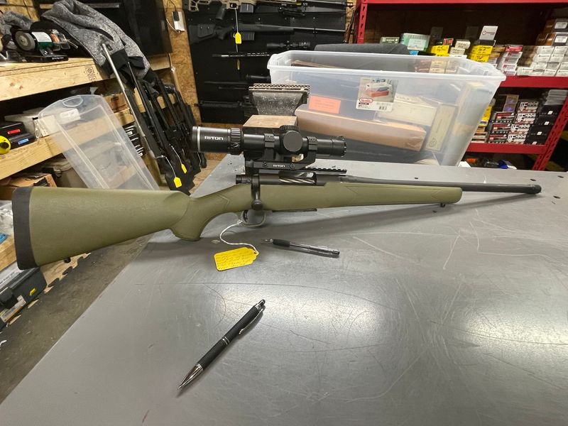 Mossberg Patriot, 450 Bushmaster, 20 inch threaded barrel. Right hand fluted bolt. Riton 1-8x24 scope. Unfired/excellent