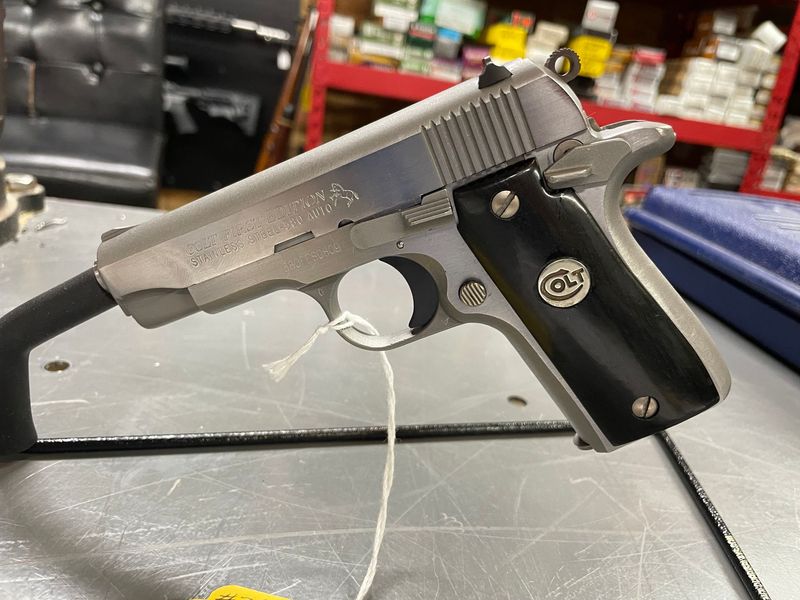 Colt Government Model 380 auto, First Edition, Stainless with Black Grips. 1989 Colt Government Model 380 auto, First Edition, Stainless with Black Grips. 1989