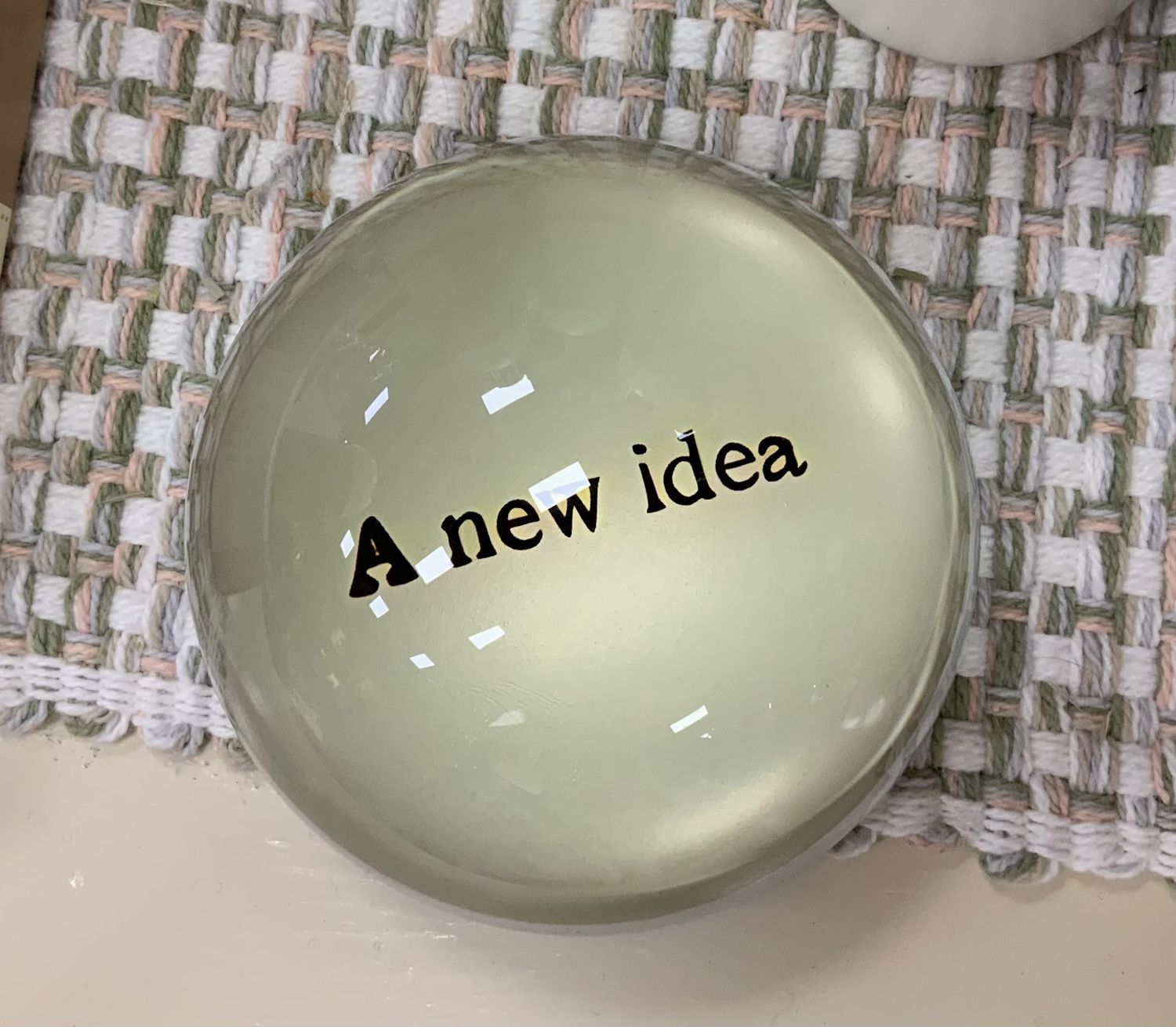 A NEW IDEA composite paperweight
