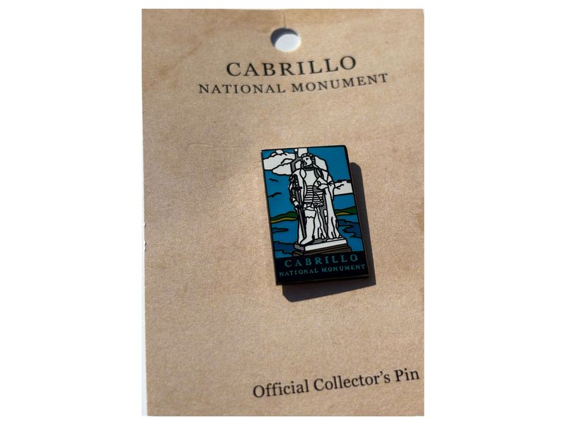 BLUE CNM STATUE PIN