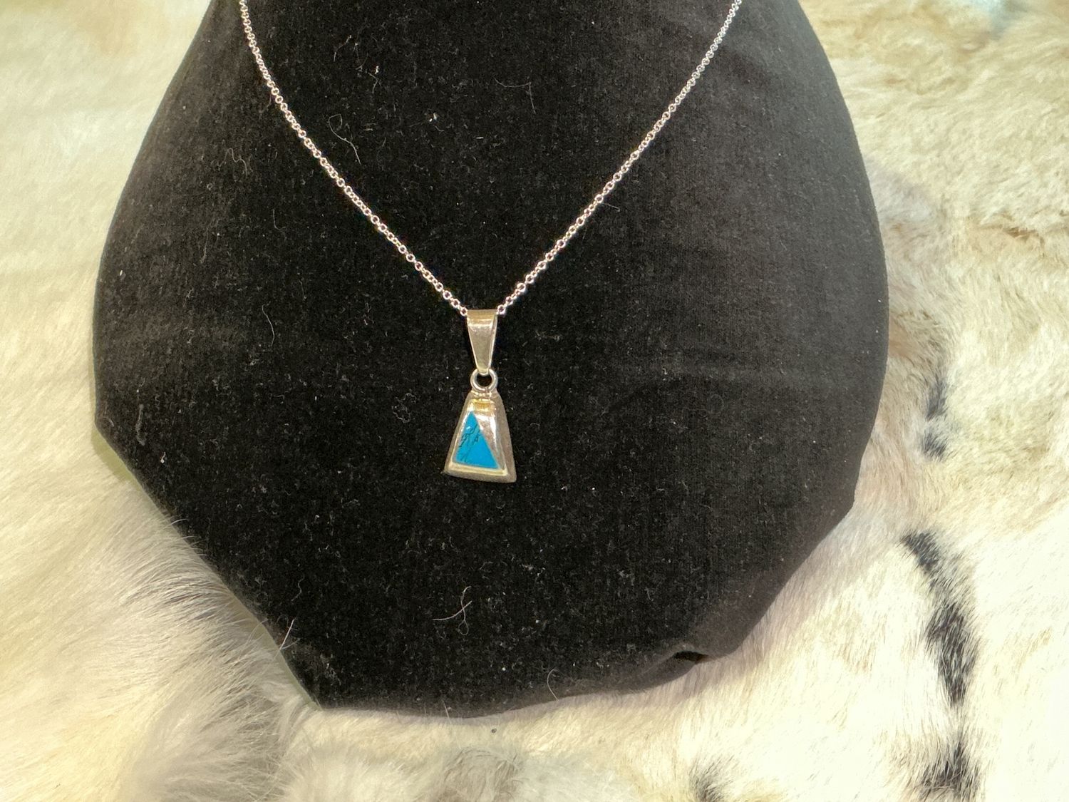 Sterling silver pendant necklace with blue triangular design