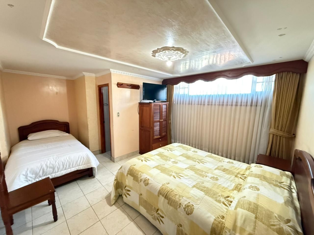 Habitación cama doble y sencilla