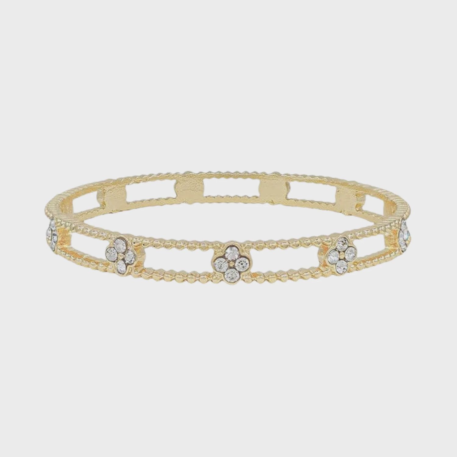 Gold Textured Bangle With Rhinestone Clover Accents