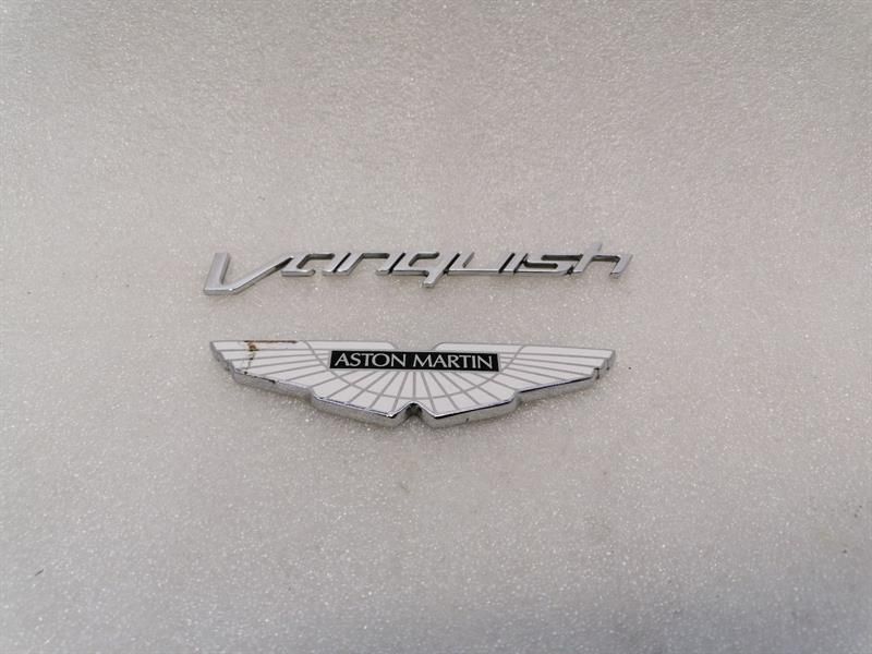 ASTON MARTIN VANQUISH AM310 CD33-407A74-BB REAR LOGOS BADGE ASSEMBLY WINGS