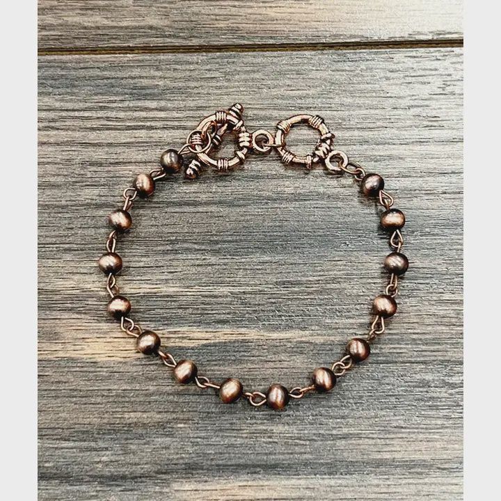 ISAC TRADING INC. COPPER NAVAJO BEAD ADJUSTABLE SINGLE STRAND BRACELET