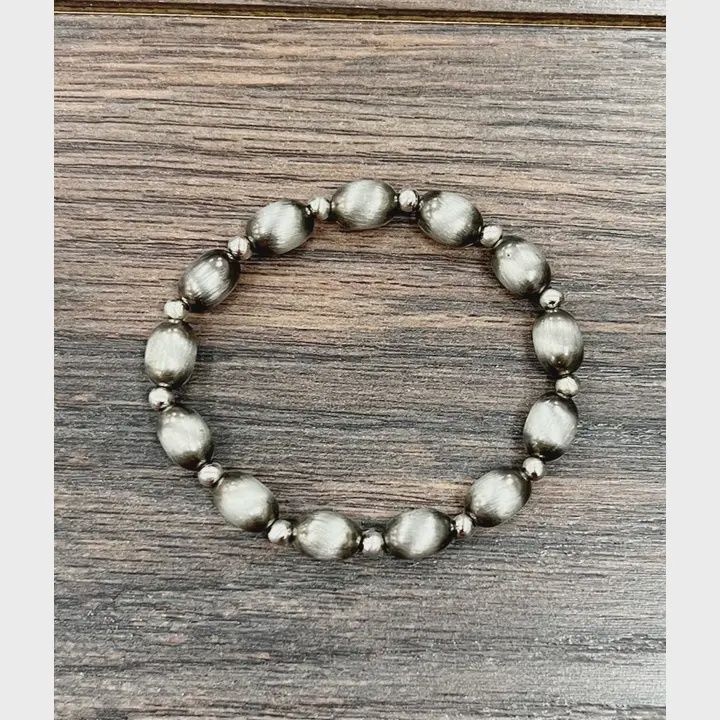 ISAC TRADING INC. 10MM NAVAJO BEAD STRETCH BRACELET - OVAL