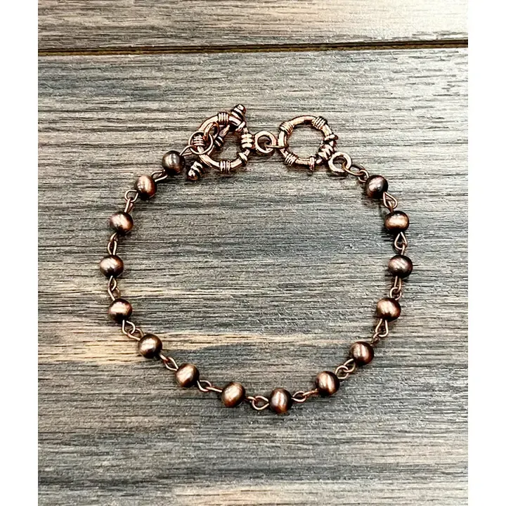 ISAC TRADING INC. COPPER NAVAJO BEAD ADJUSTABLE SINGLE STRAND BRACELET