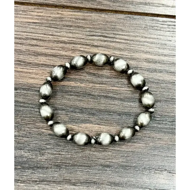 ISAC TRADING INC. 10MM OVAL NAVAJO BEAD STRETCH BRACELET