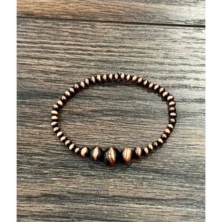 ISAC TRADING INC. COPPER NAVAJO BEAD STRETCH BRACELET