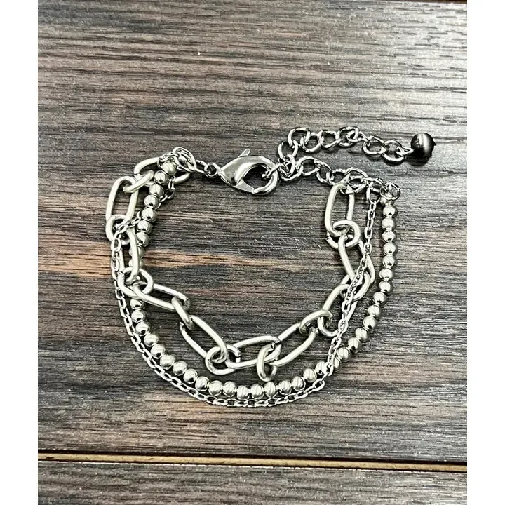 ISAC TRADING INC. SILVER NAVAJO BEAD 3 STRAND ADJUSTABLE BRACELET