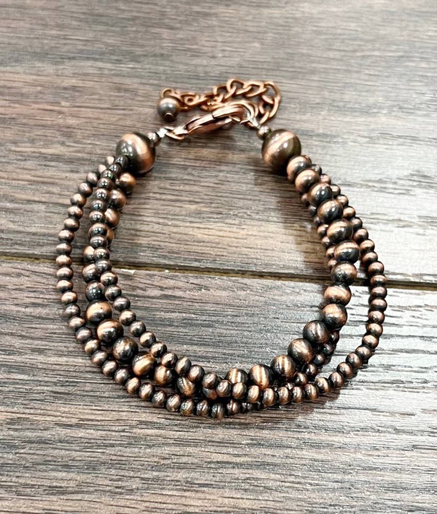 ISAC TRADING INC. WOMEN'S  COPPER WESTERN BEAD STRAND ADJUSTABLE BRACELET