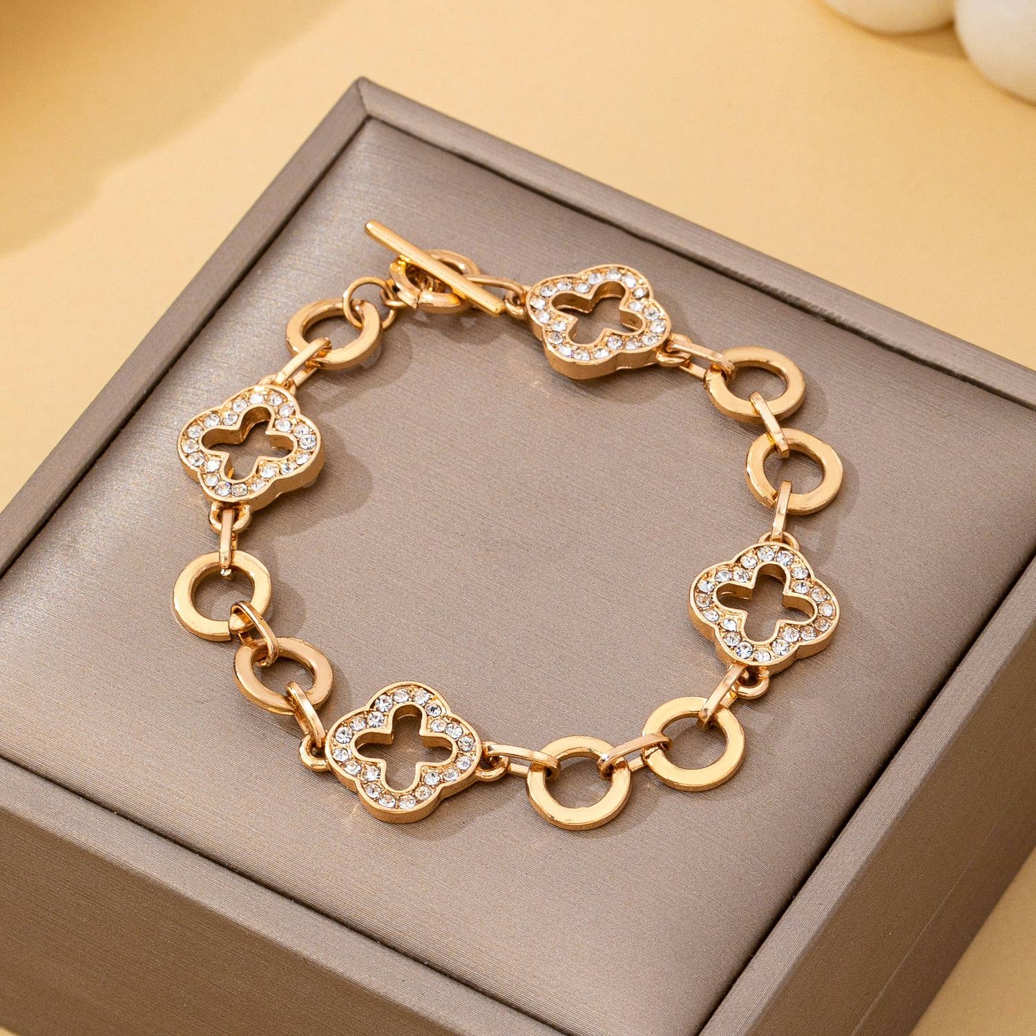 JOSSLYN BY WALL TO WALL PAVE CRYSTAL CLOVER LINK BRACELET WITH TOGGLE CLASP, COLOR: Gold