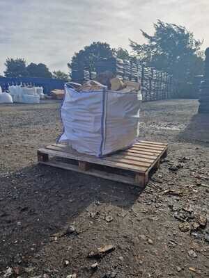Dumpy Bag of Mixed Seasoned Hardwood Logs on top of a pallet