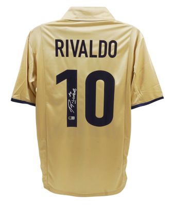 Camisola autografada do Rivaldo, Barcelona 2001/2002. Autenticada pela Beckett.  Réplica da camisola do Barcelona autografada pelo Rivaldo, número 10, Barcelona 2001/2002.  Autenticação: Holograma Beckett.  Prazo de entrega: 10 a 20 dias.  Após a con