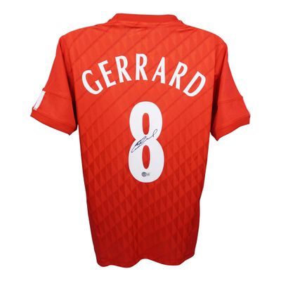 Camisola do Liverpool assinada por Steven Gerrard, número 8, época 2010/2011. Autógrafo de Gerrard. Autenticação Beckett.  Réplica da camisola do Liverpool assinada por Gerrard, número 8.  Autenticação: Holograma Beckett.  Prazo de entrega: 10 a 20 d