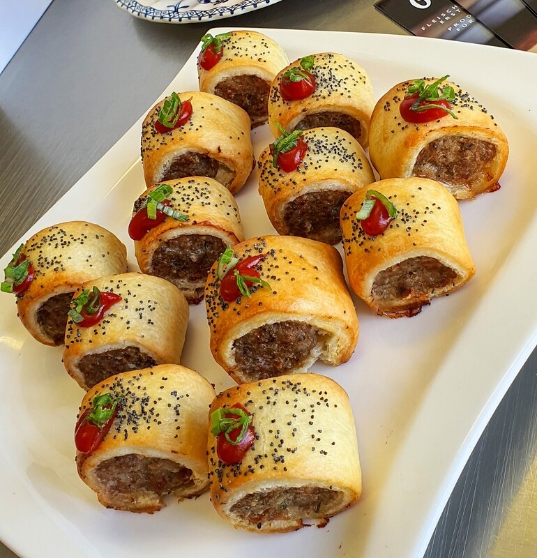 15 APERO SAUSAGE ROLLS - FROZEN....Our special in house mix of Selected Pork cuts freshly minced and blended with garden herbs, spices and wrapped in Puff Pastry. Perfect for Apero's parties, etc. 15 APERO SAUSAGE ROLLS - FROZEN....Our special in house mix of Selected Pork cuts freshly minced and blended with garden herbs, spices and wrapped in Puff Pastry. Perfect for Apero's parties, etc.